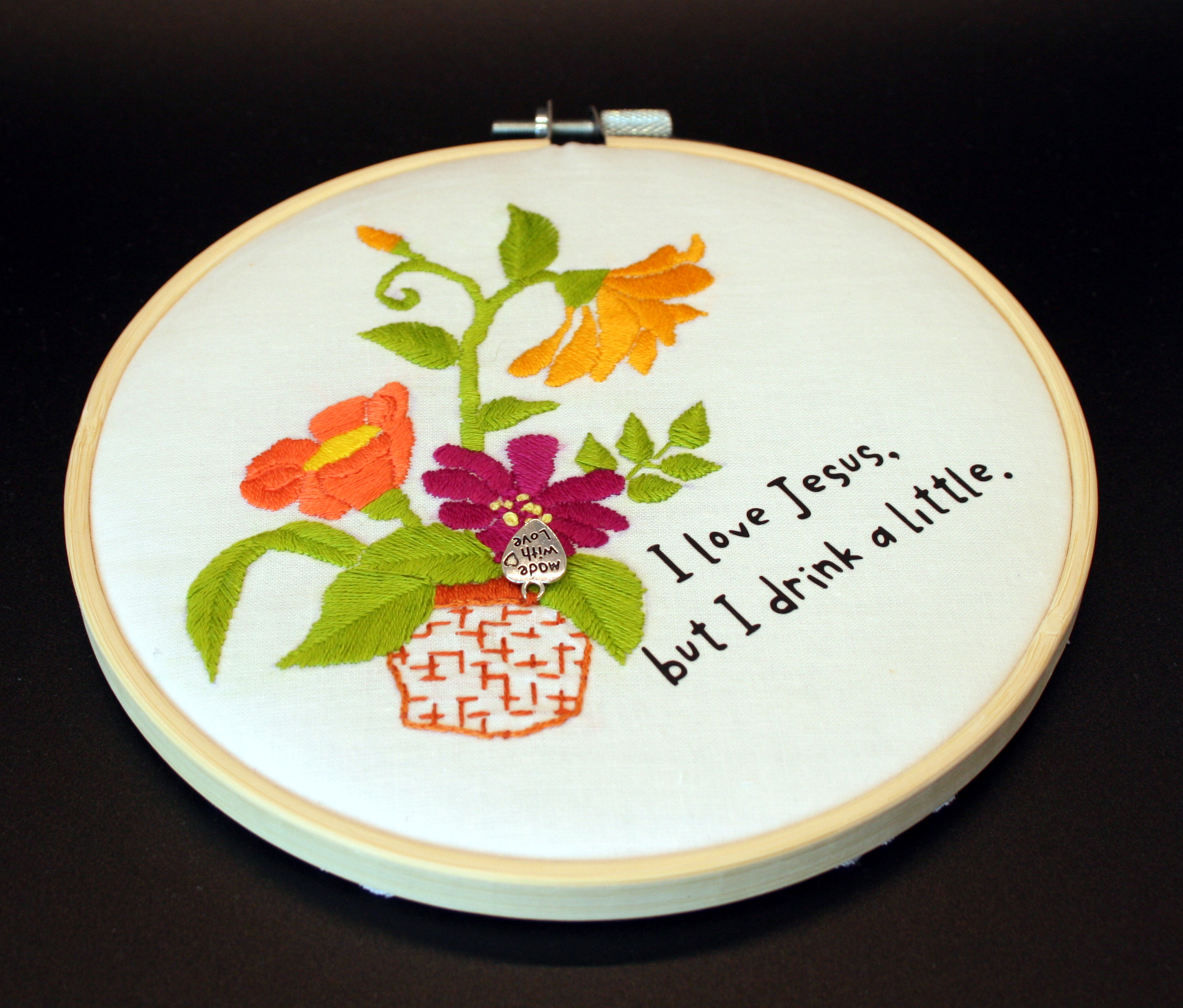 embroidery hoop with flowers and text